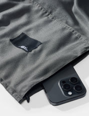 Black phone  on a gray fabric background