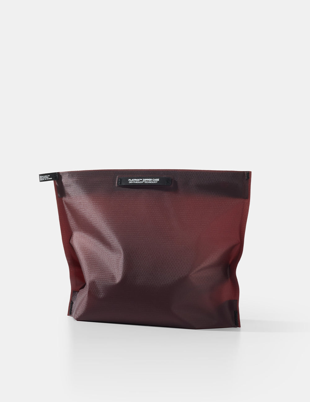 garnet toiletry case on white background