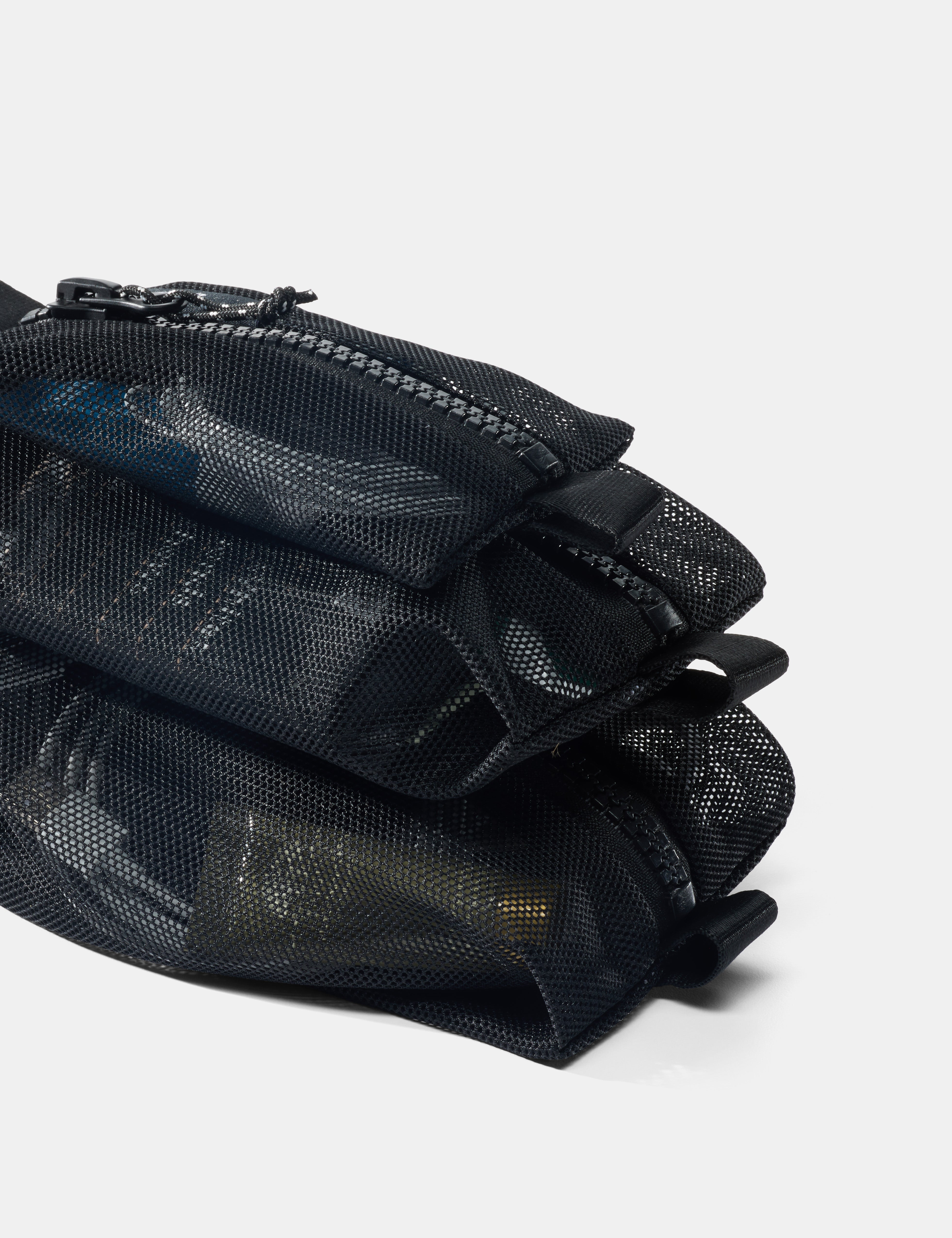 Black mesh pouch with zippers on a white background