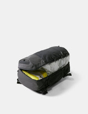Black duffel bag with open interior on a white background